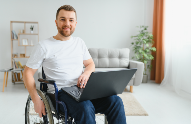 a man in a wheelchair with a laptop. Creating inclusion
